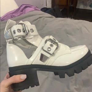 Jeffrey Campbell boots with buckles.